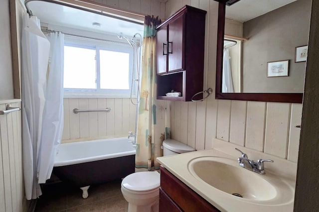 full bathroom featuring tile patterned flooring, toilet, vanity, radiator, and shower / bath combo with shower curtain