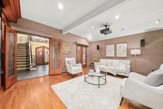 living area with lofted ceiling with beams, light wood-style flooring, recessed lighting, stairs, and french doors