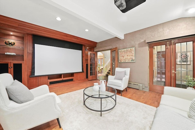 home theater featuring wood finished floors, french doors, a baseboard heating unit, beam ceiling, and recessed lighting