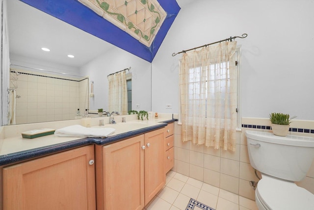 full bathroom featuring toilet, tile patterned flooring, vanity, tile walls, and recessed lighting