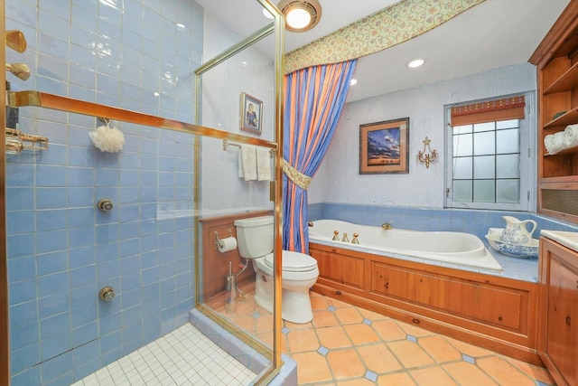 bathroom featuring tile patterned flooring, a garden tub, a tile shower, and toilet