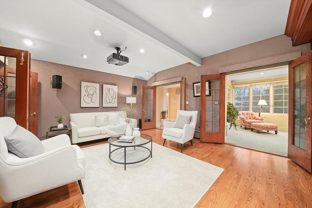 living room with french doors, light wood-type flooring, and recessed lighting