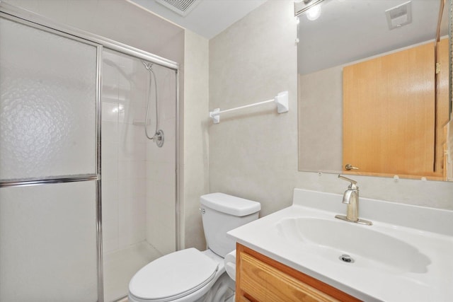 full bathroom featuring toilet, a shower stall, visible vents, and vanity