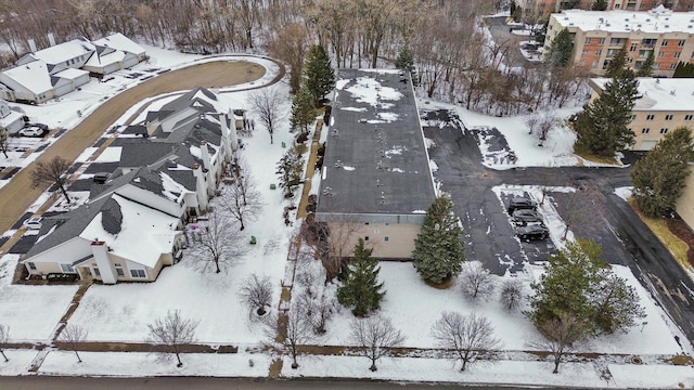 snowy aerial view with a residential view