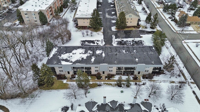 snowy aerial view featuring a residential view