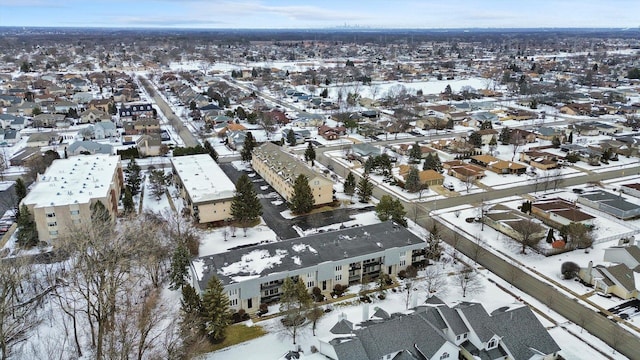 snowy aerial view with a residential view