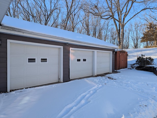 view of snow covered garage