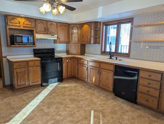 kitchen with brown cabinetry, under cabinet range hood, black appliances, open shelves, and a sink