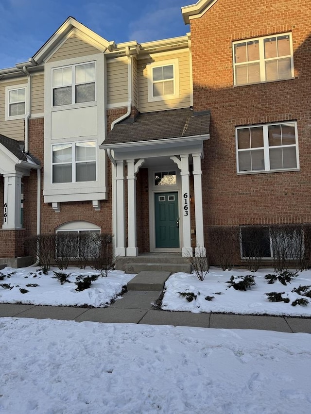 view of front of property featuring brick siding