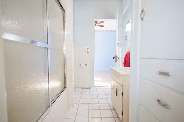 bathroom featuring vanity, bath / shower combo with glass door, and tile patterned floors