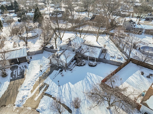 snowy aerial view with a residential view