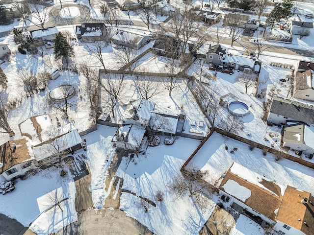 snowy aerial view featuring a residential view