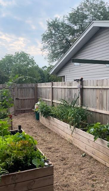 view of yard featuring a garden and fence