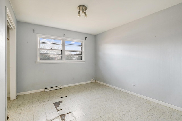 empty room with baseboards, a baseboard radiator, and tile patterned floors