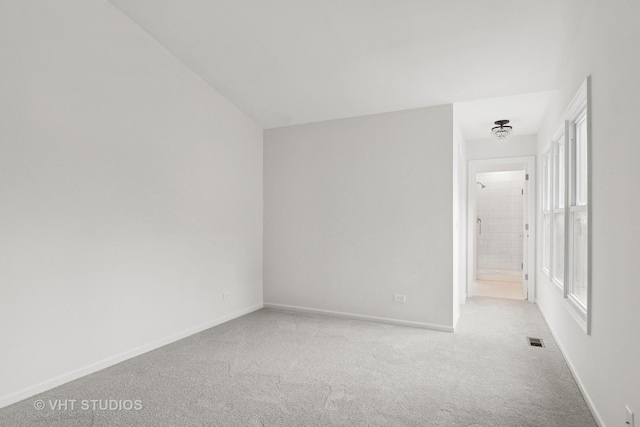 interior space featuring carpet, visible vents, and baseboards