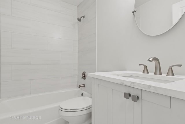 bathroom featuring shower / bathtub combination, vanity, and toilet