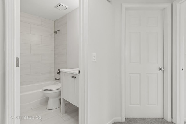 bathroom with tub / shower combination, vanity, and toilet