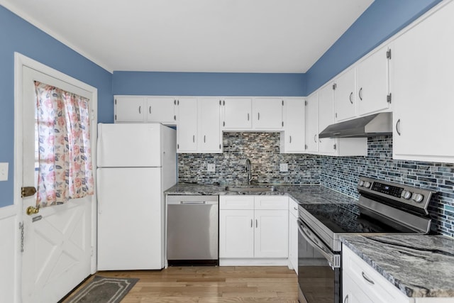 kitchen featuring stainless steel appliances, white cabinets, a sink, and under cabinet range hood