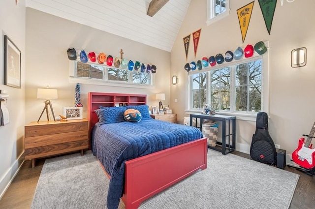 bedroom with high vaulted ceiling, wood finished floors, beam ceiling, and baseboards