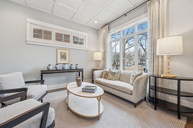 living area featuring baseboards