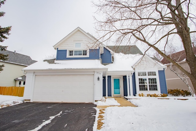 traditional-style house with driveway and an attached garage