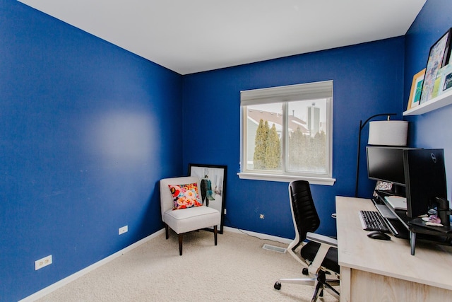 carpeted home office with baseboards