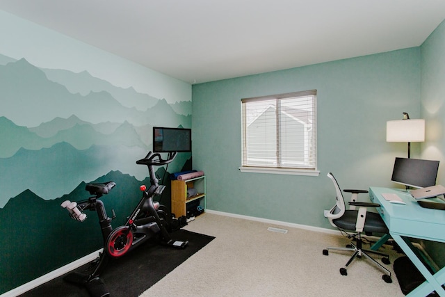 carpeted home office featuring baseboards