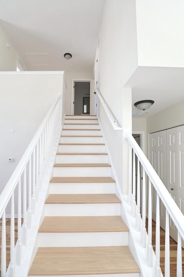 staircase with wood finished floors