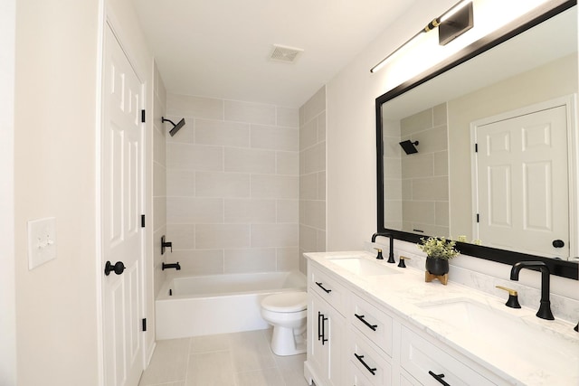 full bath featuring toilet, tile patterned flooring, visible vents, and a sink