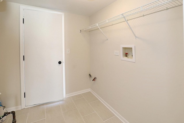 washroom with washer hookup, laundry area, and baseboards