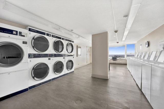 common laundry area featuring stacked washing maching and dryer and washer and dryer