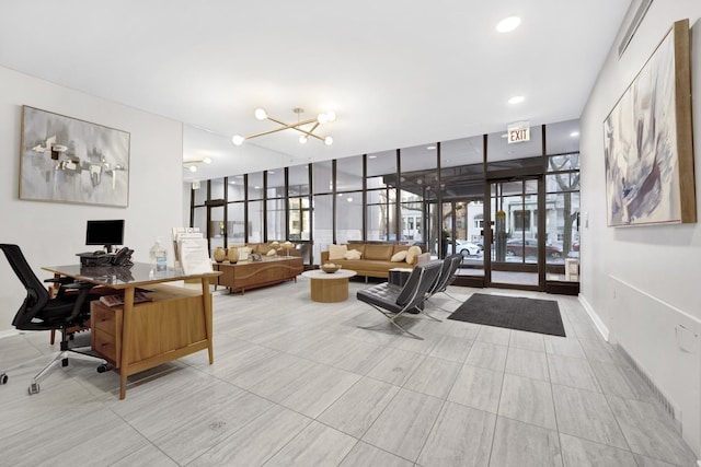 interior space with recessed lighting, a wall of windows, an inviting chandelier, and baseboards