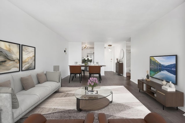 living room featuring dark wood-style floors and visible vents