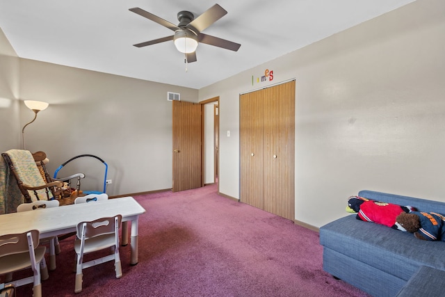 interior space featuring carpet, visible vents, and a ceiling fan