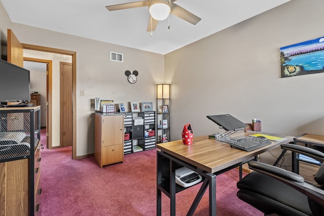 carpeted office with visible vents and ceiling fan