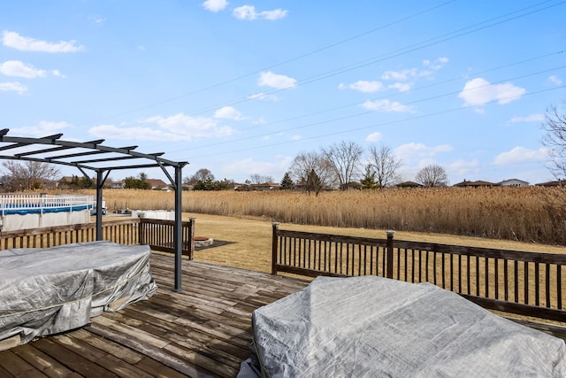 wooden terrace featuring a covered pool and a pergola