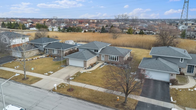 birds eye view of property with a residential view