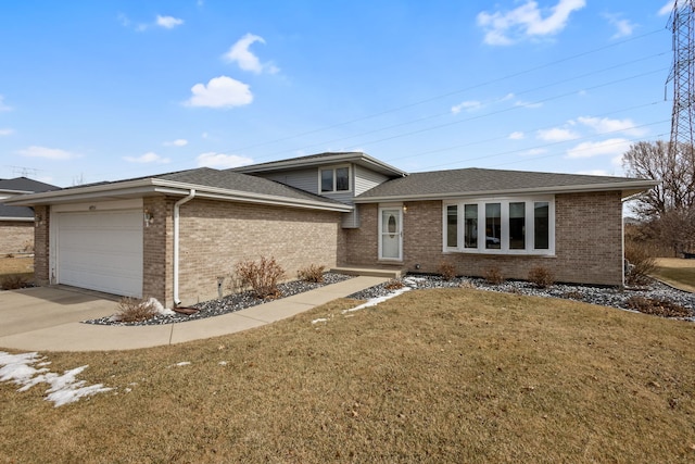 view of front facade featuring an attached garage, brick siding, a shingled roof, driveway, and a front yard