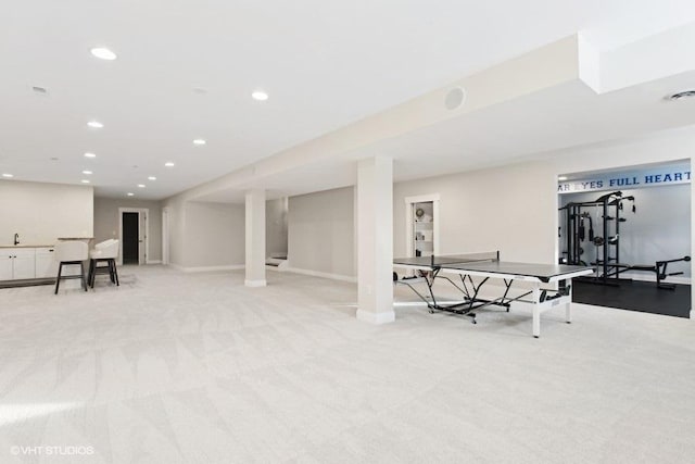 interior space with recessed lighting, light carpet, and baseboards