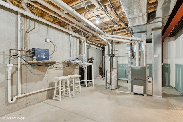 unfinished basement featuring gas water heater and heating unit