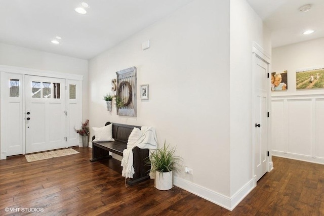 foyer with dark wood-type flooring, recessed lighting, and baseboards