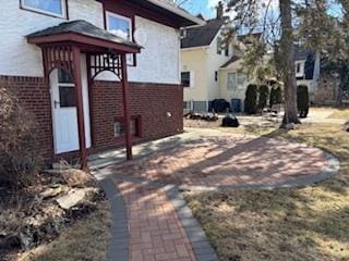 view of property exterior with brick siding