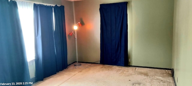 spare room featuring unfinished concrete floors