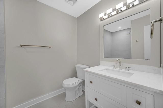 full bath with visible vents, toilet, vanity, baseboards, and walk in shower