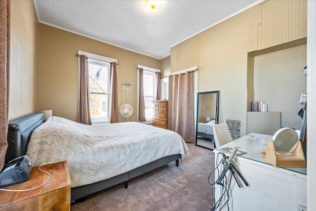 carpeted bedroom with ornamental molding