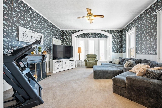 living room featuring ornamental molding, carpet flooring, and wallpapered walls