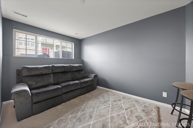 living area featuring carpet, baseboards, and visible vents