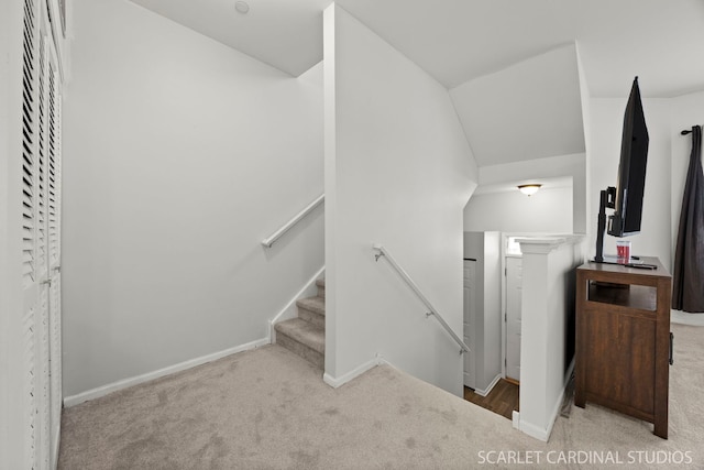 stairway with carpet flooring and baseboards