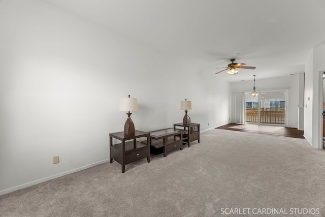 unfurnished room with a ceiling fan, carpet flooring, and baseboards