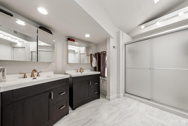 bathroom with marble finish floor, two vanities, a sink, and a shower stall